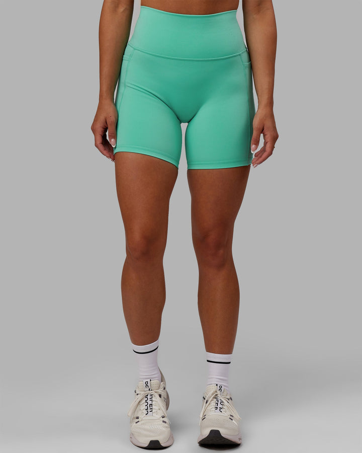 Woman wearing Fusion Mid-Length Shorts - Aquatic Awe