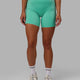 Woman wearing Fusion Mid-Length Shorts - Aquatic Awe