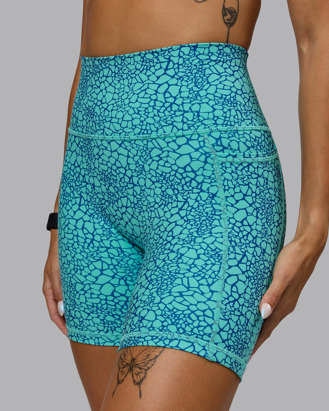 Woman wearing Fusion Mid Short Tights - Aquatic Awe Vitality Print