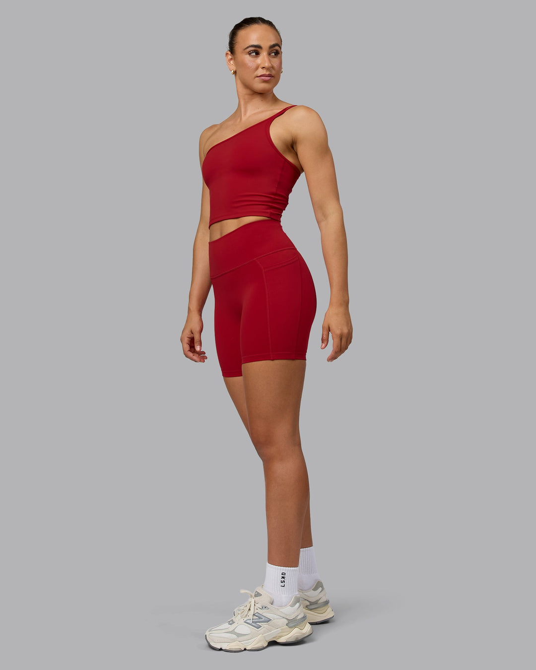 Woman wearing Fusion Mid Short Tights with Pockets - Cherry Red