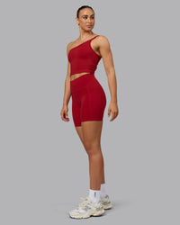 Woman wearing Fusion Ultra High-Rise 6" Short Pockets - Cherry Red | Model:Sophie | Size:S