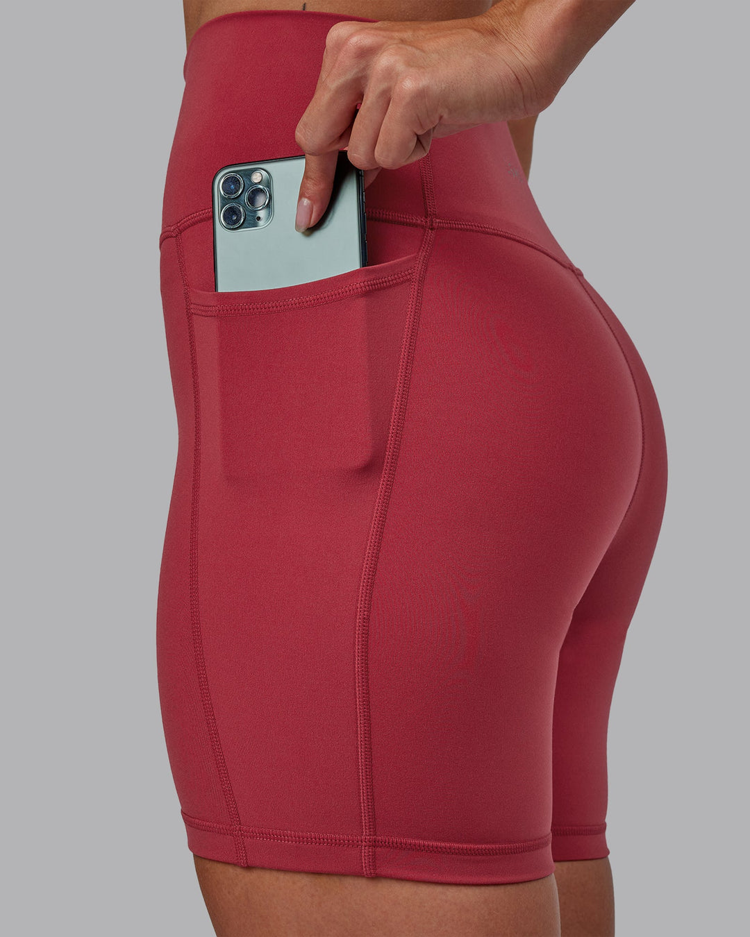 Woman wearing Fusion Ultra High-Rise 6&quot; Short Pockets - Claret | Model:Blaize | Size:S