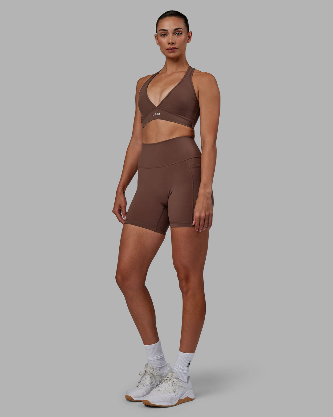 Woman wearing Fusion Mid-Length Shorts - Dull Rust