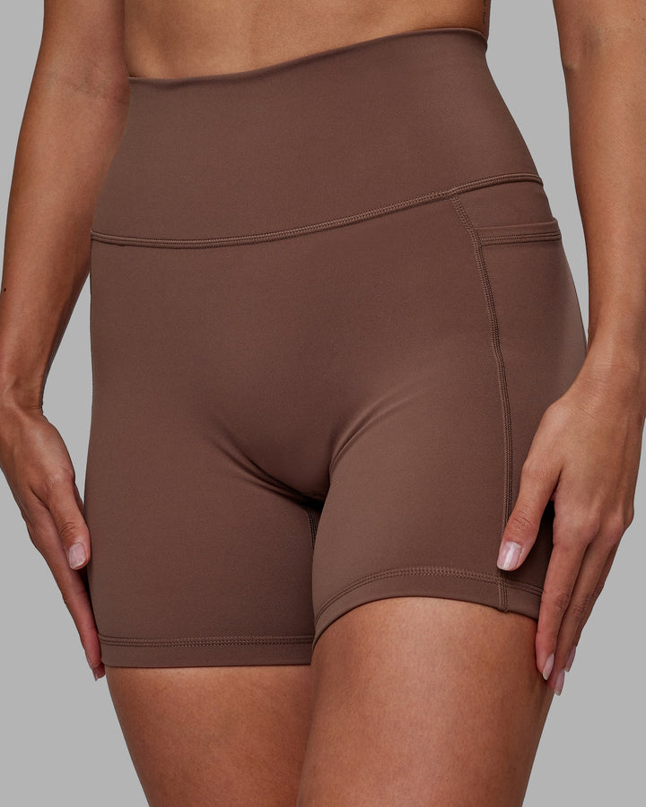 Woman wearing Fusion Mid-Length Shorts - Dull Rust
