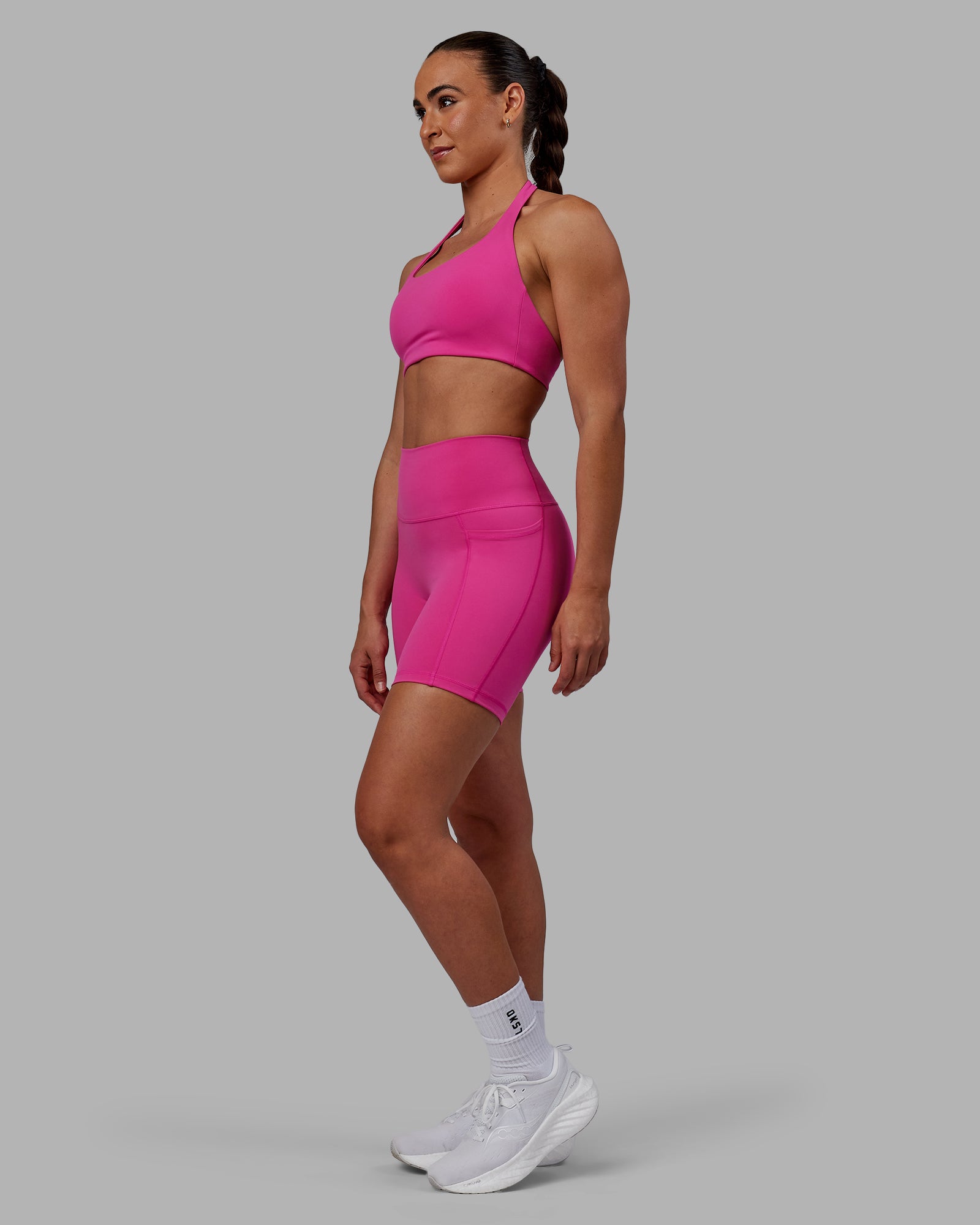 Woman wearing Fusion Ultra High-Rise 6" Short Pockets - Fuchsia Pink | Model:Sophie | Size:S
