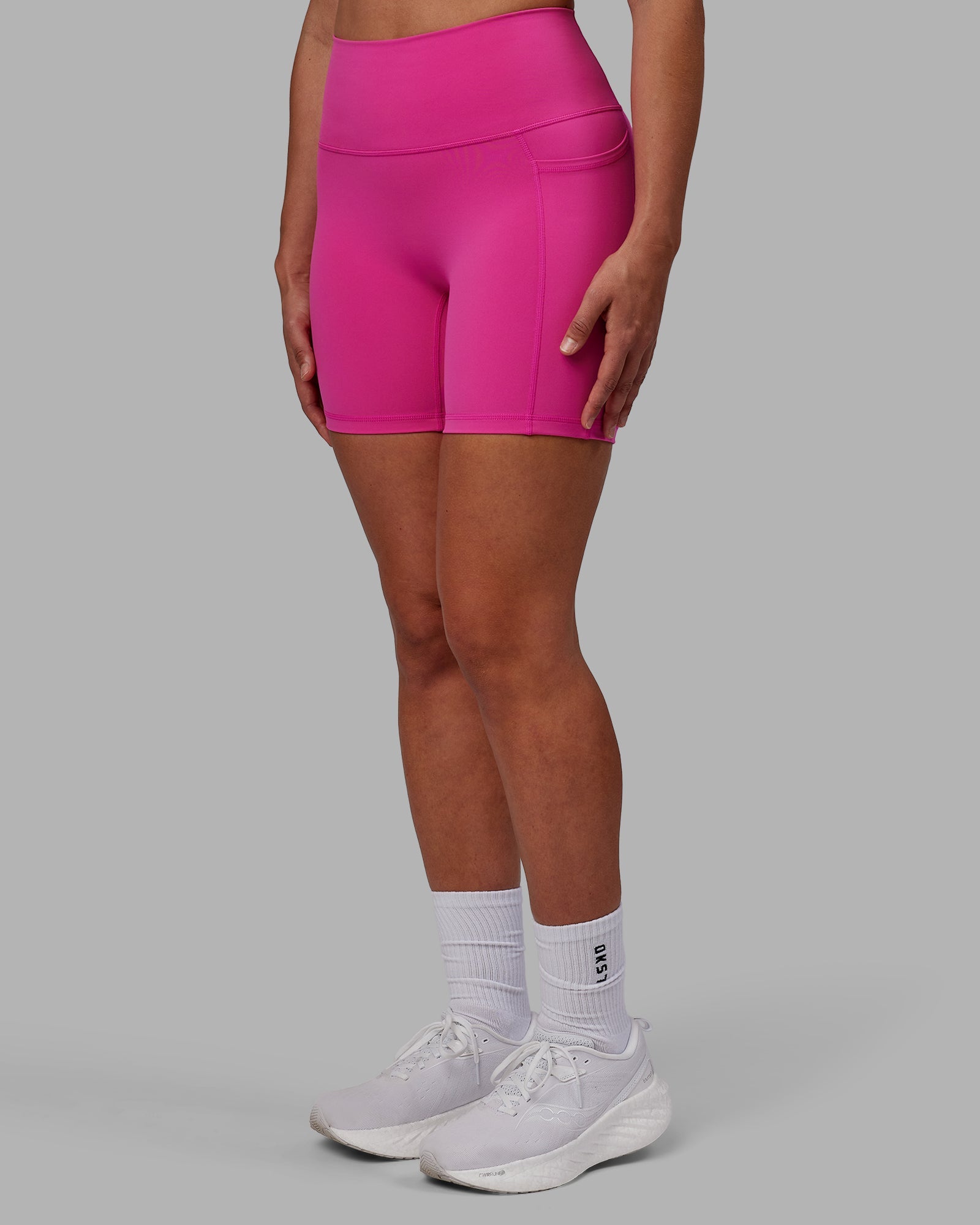 Woman wearing Fusion Ultra High-Rise 6" Short Pockets - Fuchsia Pink | Model:Sophie | Size:S