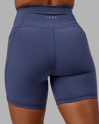 Woman wearing Fusion Ultra High-Rise 6" Short Pockets - Future Dusk | Model:Gabby | Size:S