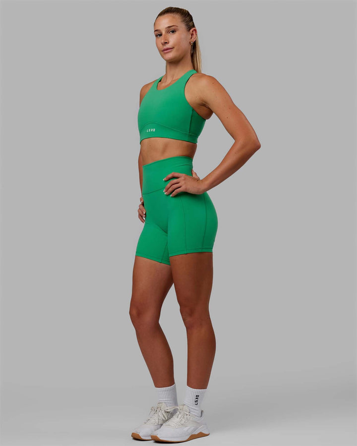 Woman wearing Fusion Mid-Length Shorts - Holly Green
