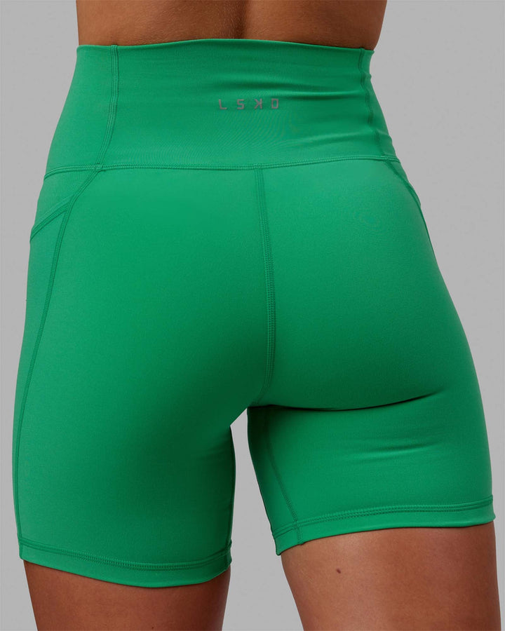 Woman wearing Fusion Mid-Length Shorts - Holly Green
