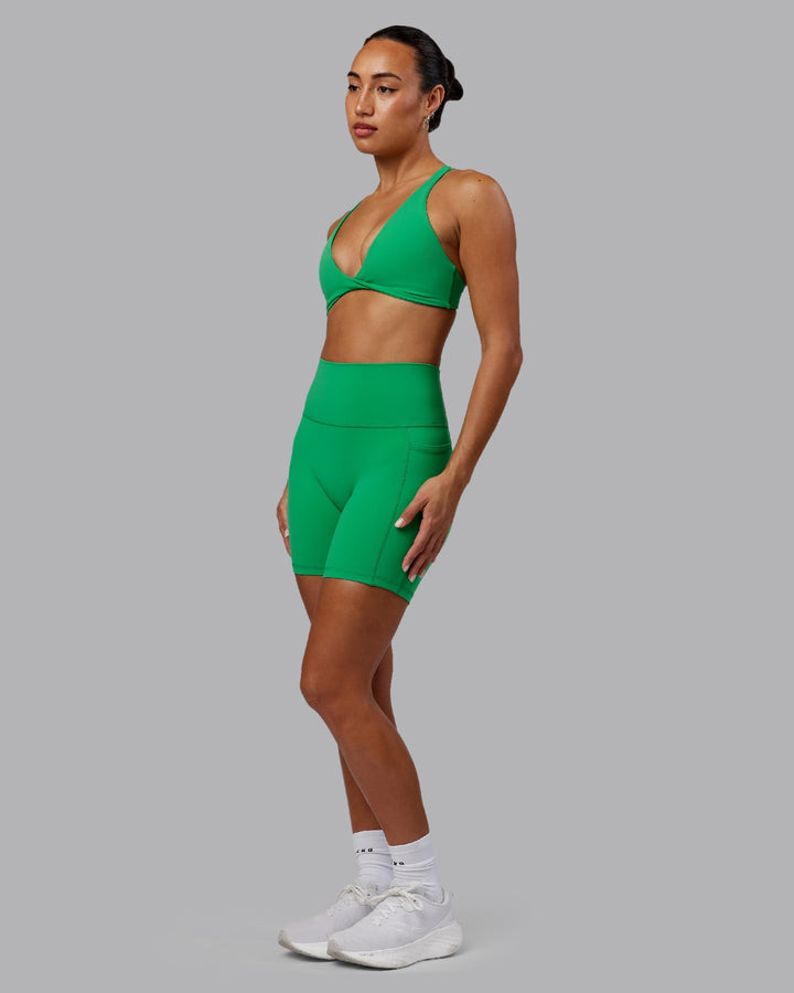 Woman wearing Fusion Mid-Length Shorts - Impact Green
