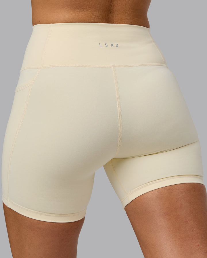 Woman wearing Fusion Mid Short Tights with Pockets - Ivory
