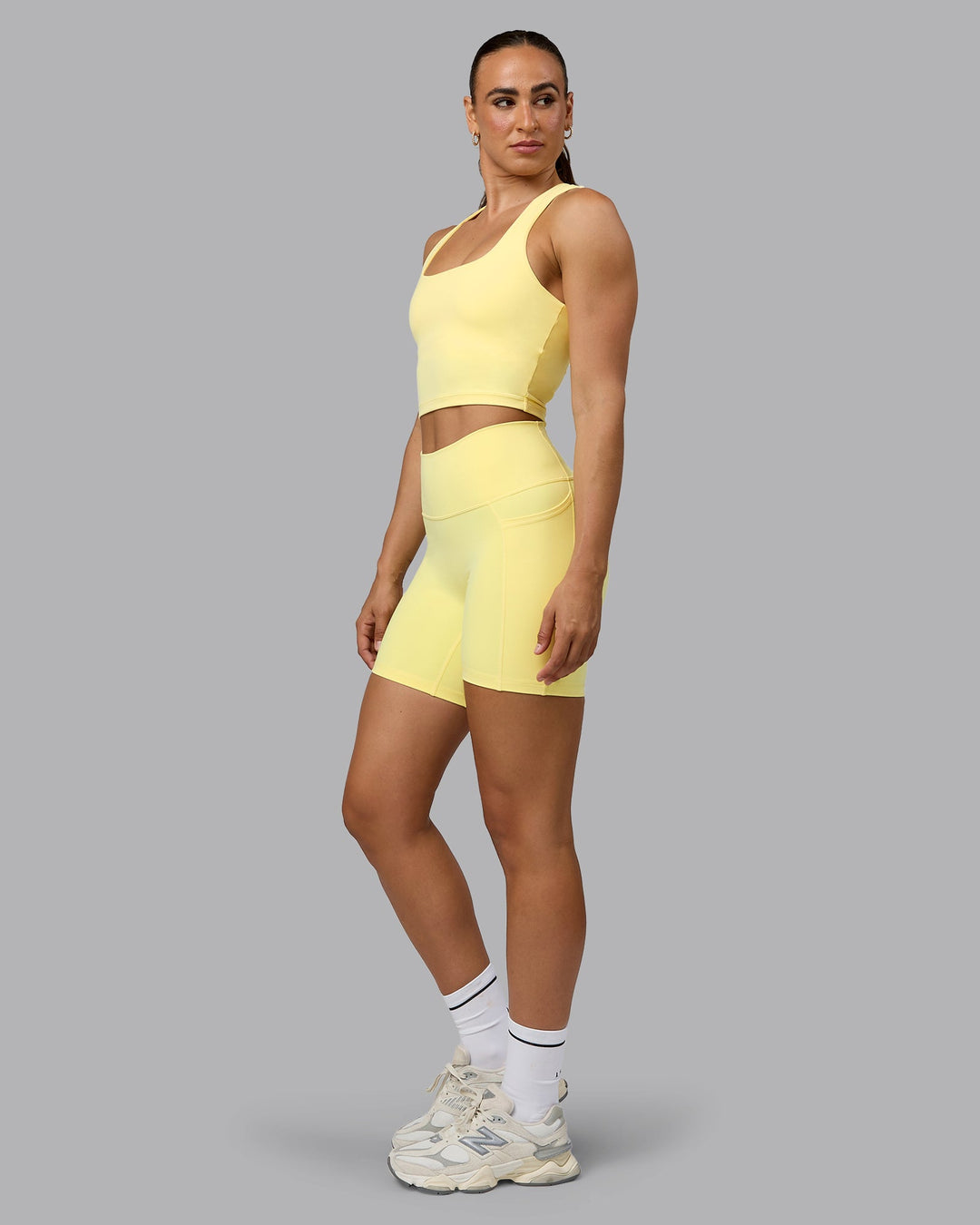 Woman wearing Fusion Mid Short Tights with Pockets - Lemon