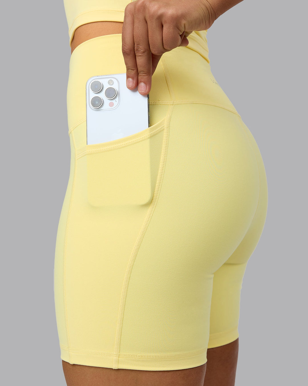 Woman wearing Fusion Mid Short Tights with Pockets - Lemon