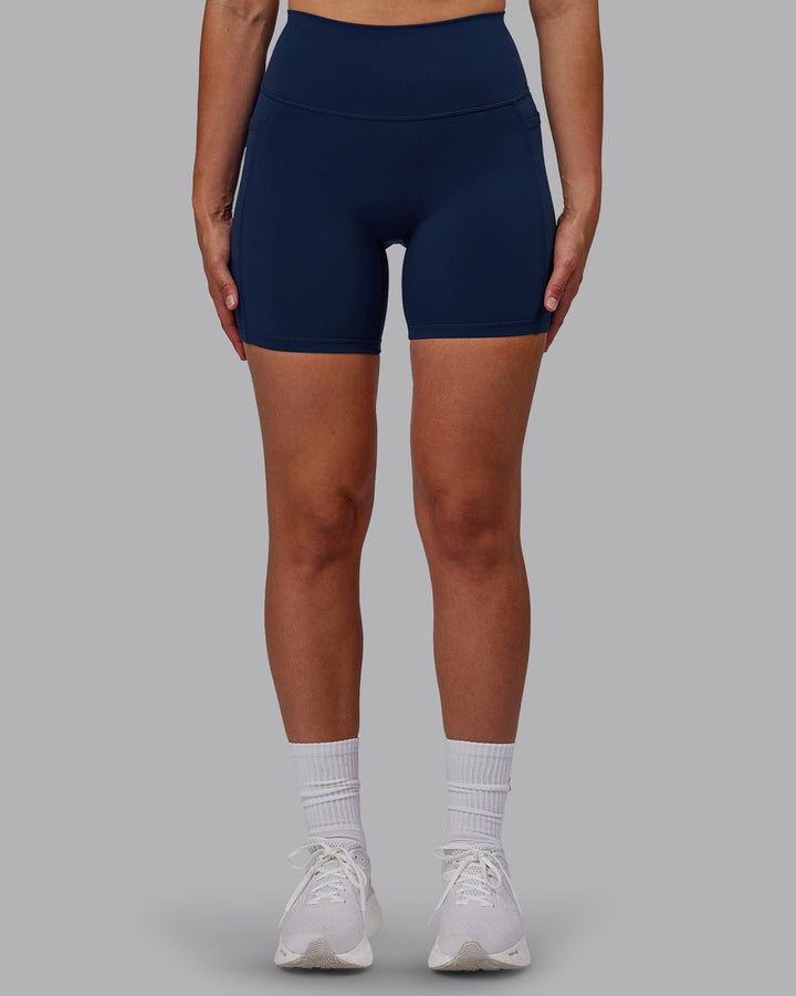 Woman wearing Fusion Mid Short Tights with Pockets - Future Navy
