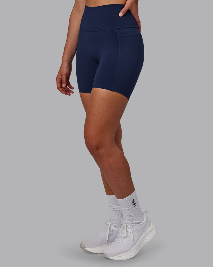 Woman wearing Fusion Mid Short Tights with Pockets - Future Navy
