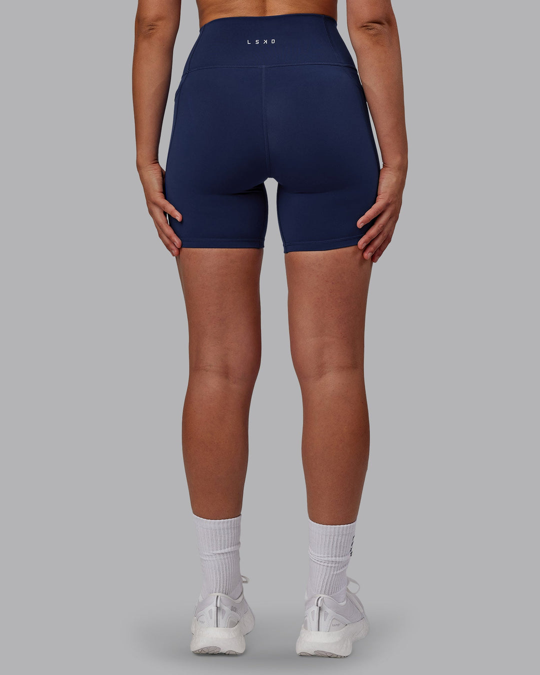 Woman wearing Fusion Mid Short Tights with Pockets - Future Navy