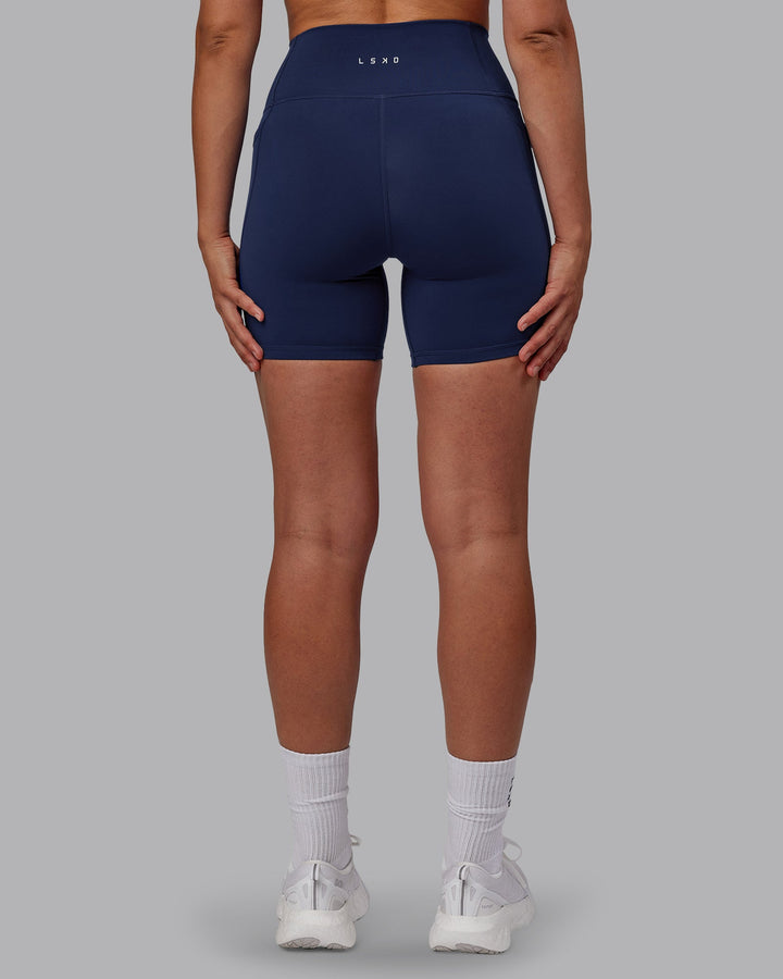 Woman wearing Fusion Mid Short Tights with Pockets - Future Navy
