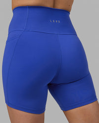 Woman wearing Fusion Ultra High-Rise 6" Short Pockets - Power Cobalt | Model:Hannah | Size:S