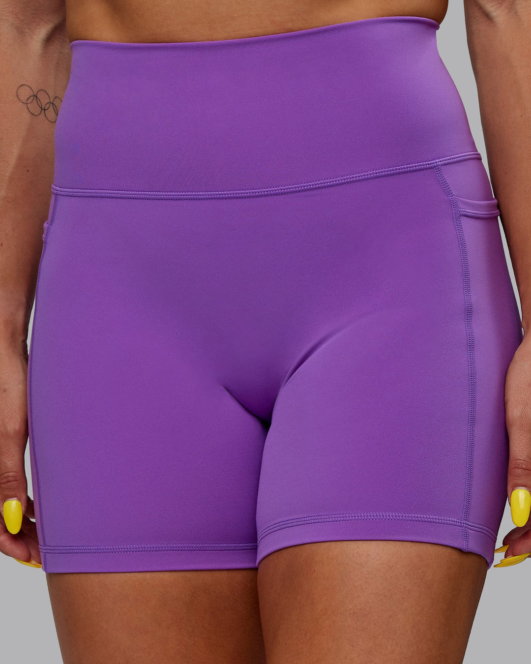 Woman wearing Fusion Ultra High-Rise 6&quot; Short Pockets - Purple Swirl | Model:Bree | Size:S