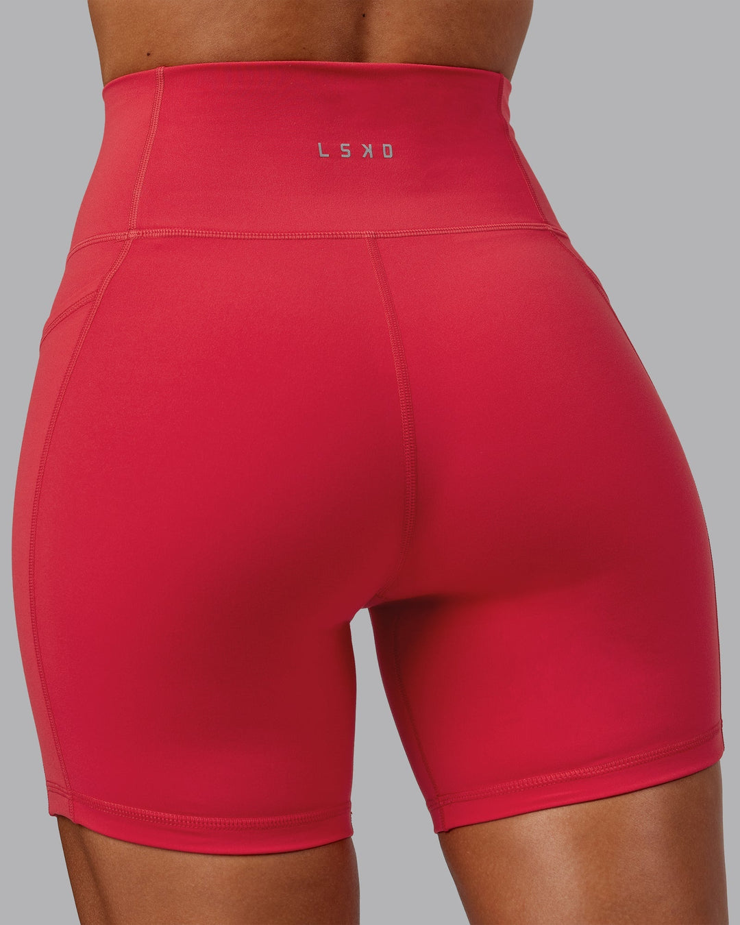 Woman wearing Fusion Mid-Length Shorts - Scarlet