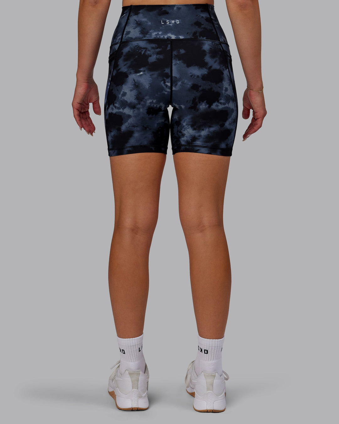 Woman wearing Fusion Mid-Length Shorts - Tie Dye-Midnight