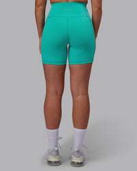 Woman wearing Fusion Ultra High-Rise 6" Short Pockets - Turquoise Tide | Model:Hannah | Size:S