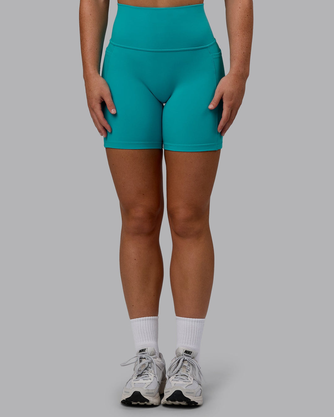 Woman wearing Fusion Mid Short Tights - Uplift Blue