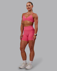 Woman wearing Fusion Ultra High-Rise 6" Short Pockets - Hot Pink | Model:Amber | Size:S