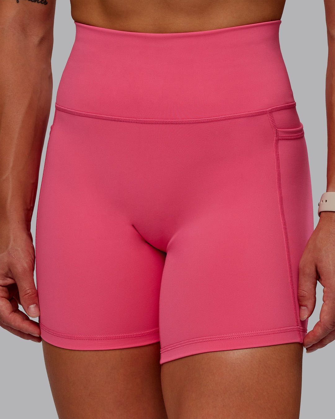 Woman wearing Fusion Mid Short Tight With Pockets - Hot Pink