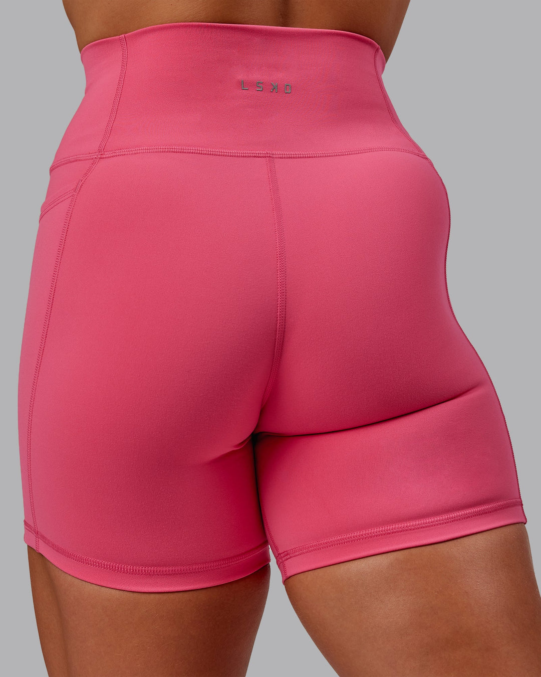 Woman wearing Fusion Mid Short Tight With Pockets - Hot Pink