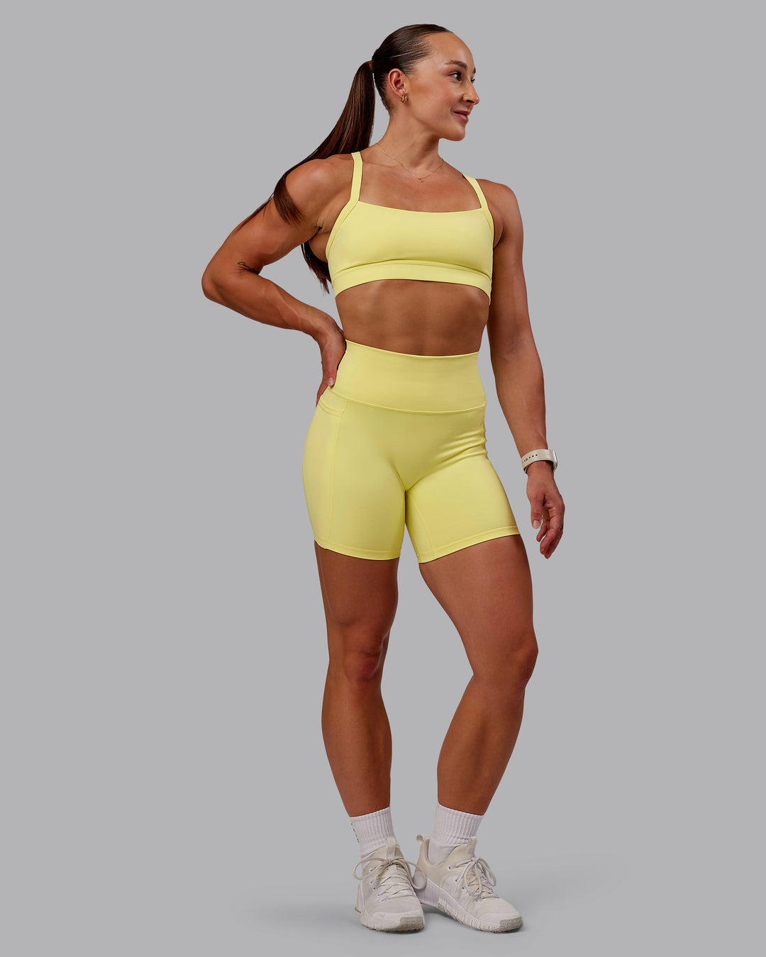 Woman wearing Fusion Mid Short Tight With Pockets - Lemon Fizz