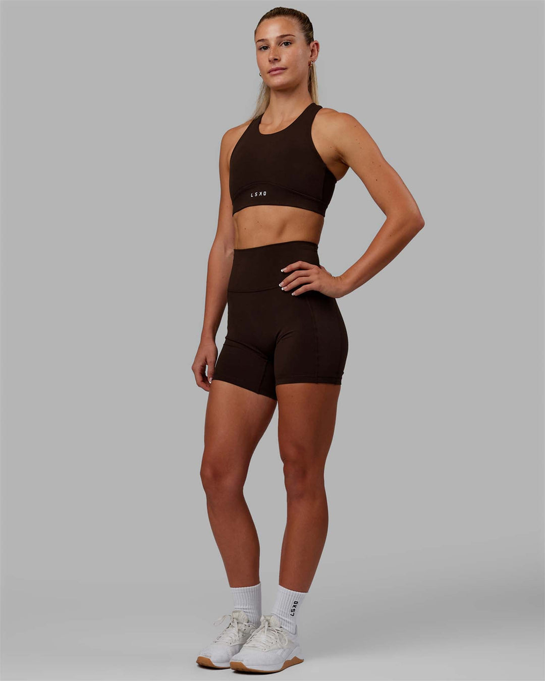 Woman wearing Fusion Sports Bra - Dark Chocolate