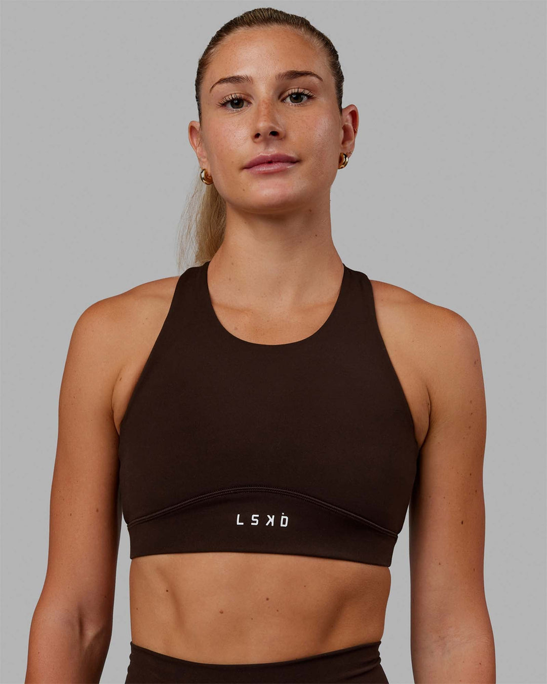 Woman wearing Fusion Sports Bra - Dark Chocolate