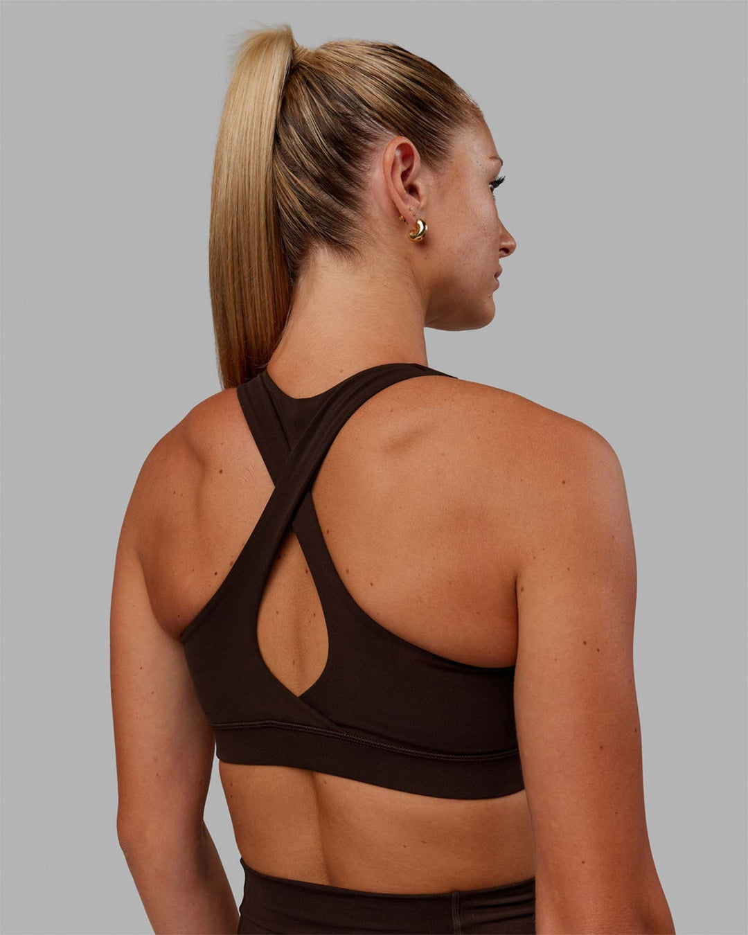 Woman wearing Fusion Sports Bra - Dark Chocolate