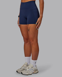 Woman wearing Fusion Ultra High-Rise 4" Short Pockets - Future Dusk | Model:Gabby | Size:S