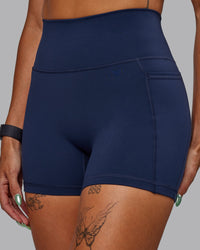 Woman wearing Fusion Ultra High-Rise 4" Short Pockets - Future Dusk | Model:Gabby | Size:S