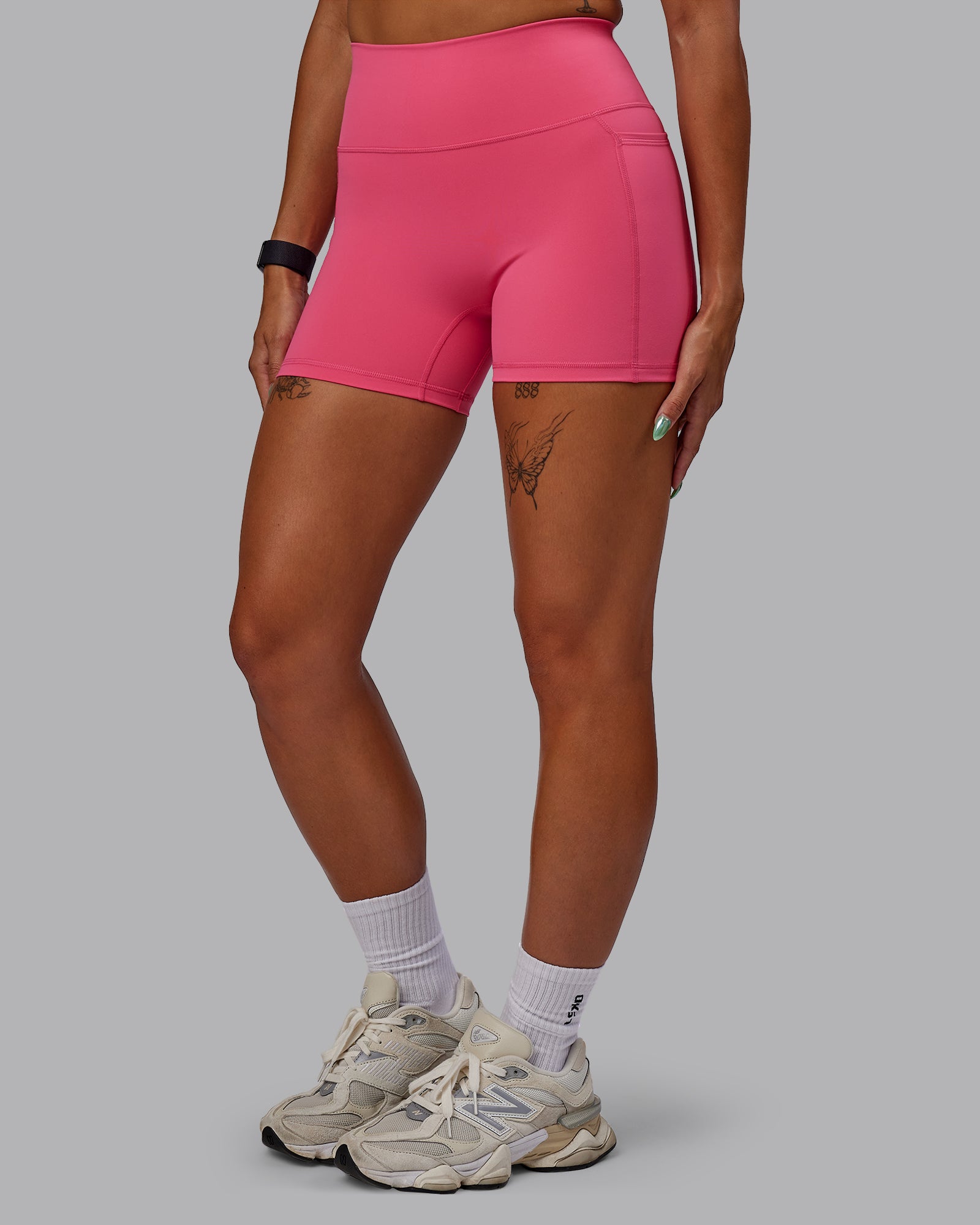 Woman wearing Fusion Ultra High-Rise 4" Short Pockets - Hot Pink | Model:Vanessa | Size:S