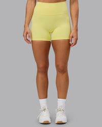 Woman wearing Fusion Ultra High-Rise 4" Short Pockets - Lemon Fizz | Model:Shalem | Size:S | Thumbnail Index: 7