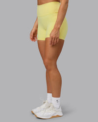 Woman wearing Fusion Ultra High-Rise 4" Short Pockets - Lemon Fizz | Model:Shalem | Size:S | Thumbnail Index: 5