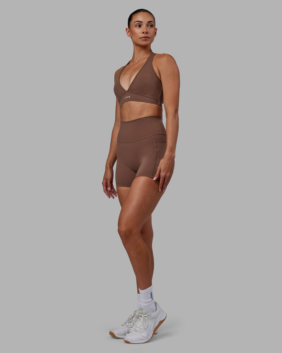 Woman wearing Fusion X-Length Shorts - Dull Rust