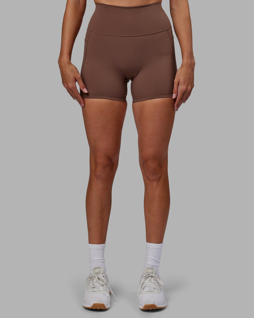 Woman wearing Fusion X-Length Shorts - Dull Rust