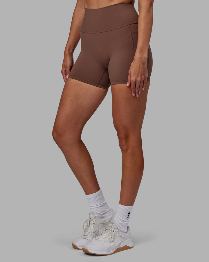 Woman wearing Fusion X-Length Shorts - Dull Rust
