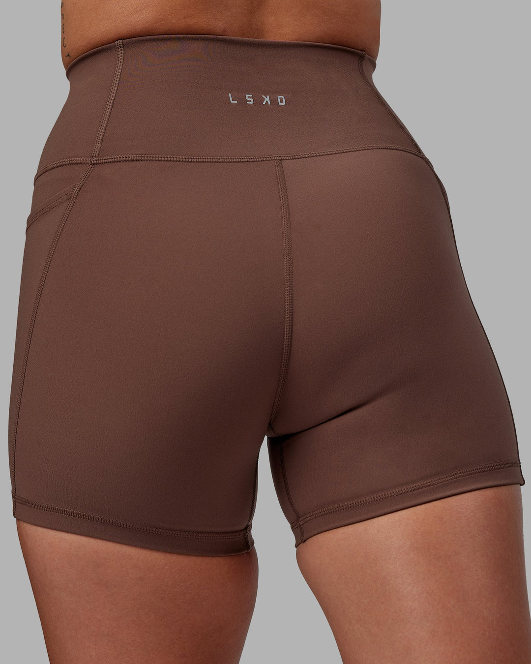 Woman wearing Fusion X-Length Shorts - Dull Rust