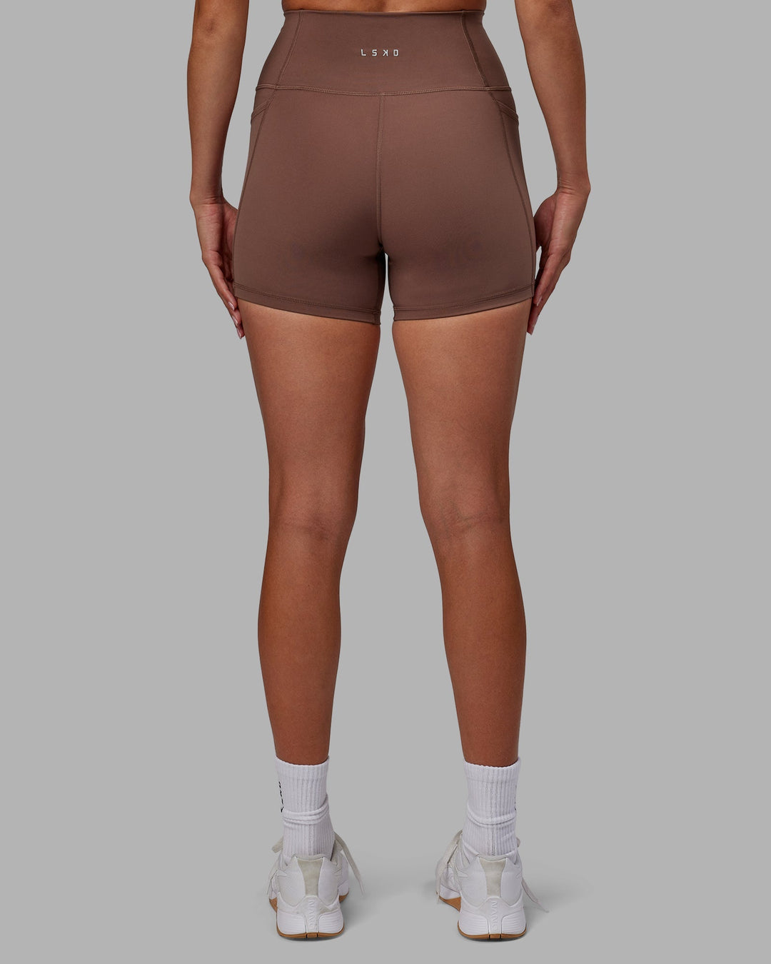 Woman wearing Fusion X-Length Shorts - Dull Rust