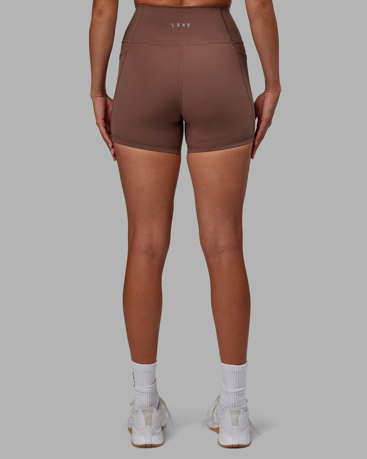 Woman wearing Fusion X-Length Shorts - Dull Rust
