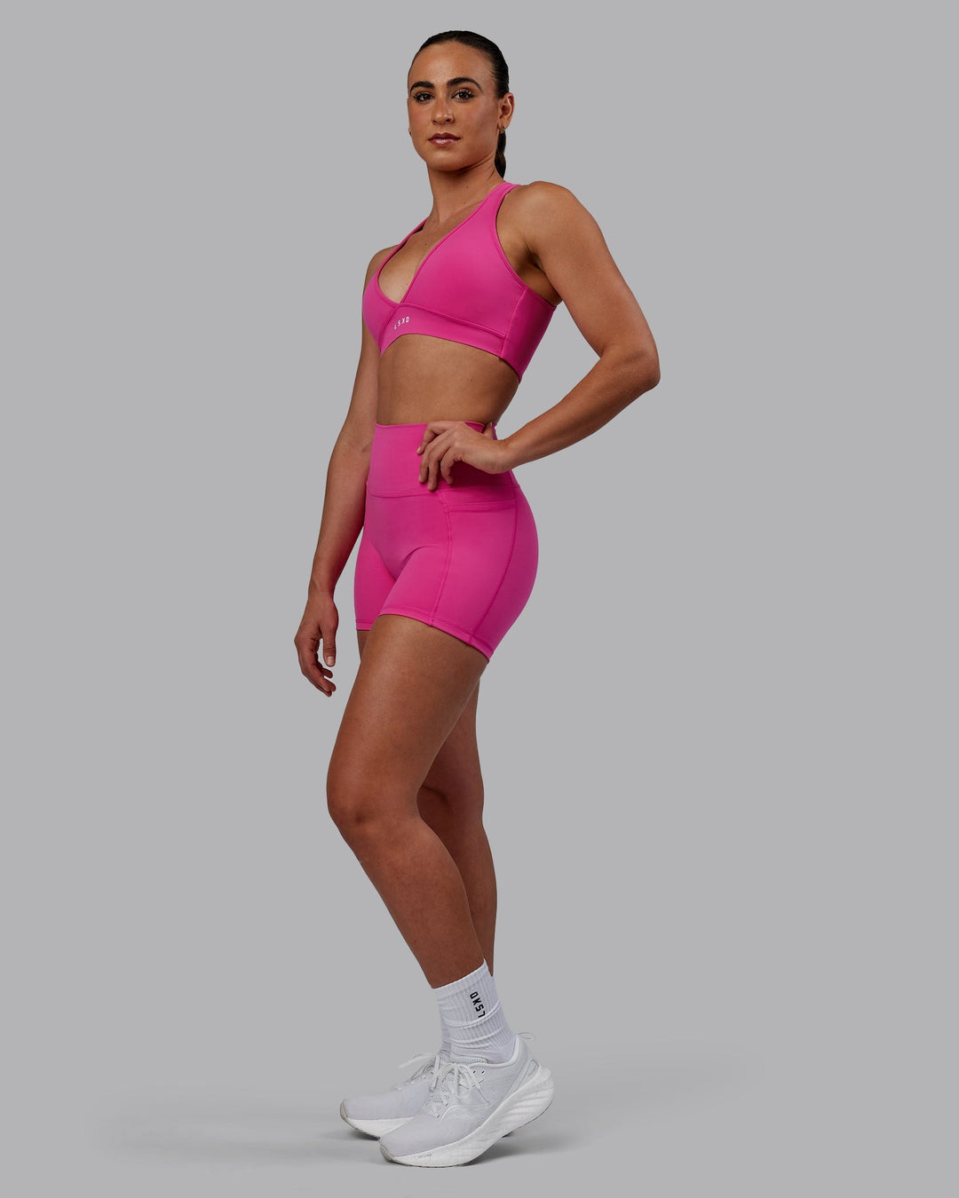 Woman wearing Fusion X-Length Shorts - Fuchsia Pink