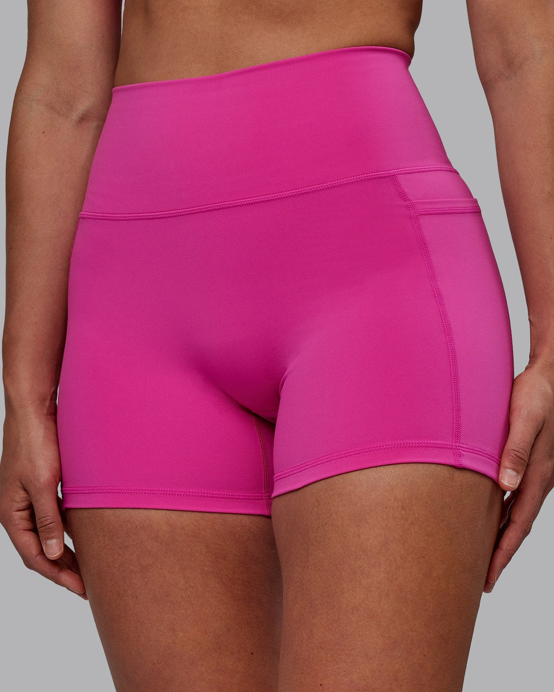 Woman wearing Fusion X-Length Shorts - Fuchsia Pink