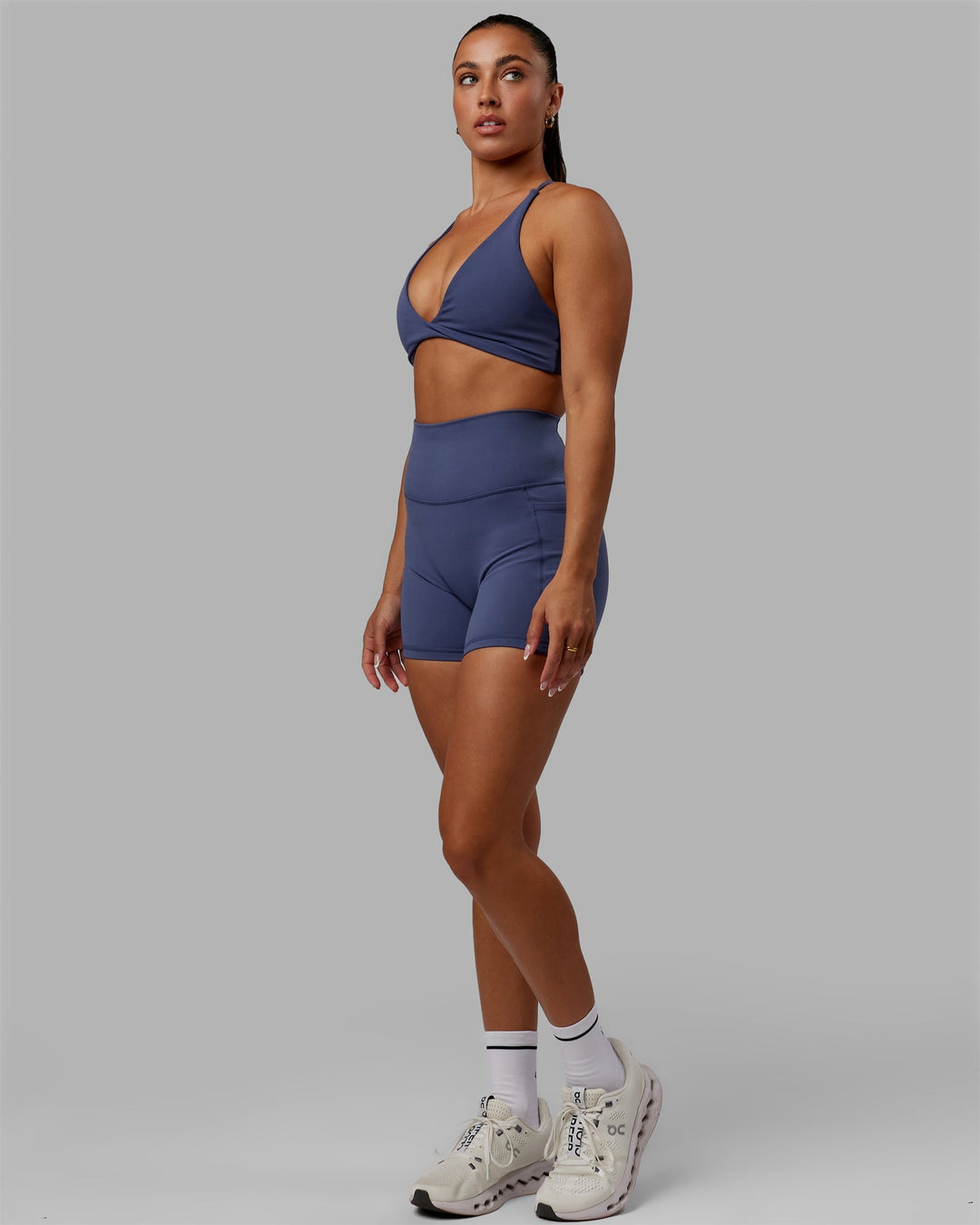 Woman wearing Fusion Ultra High-Rise 4" Short Pockets - Future Dusk | Model:Gabby | Size:S