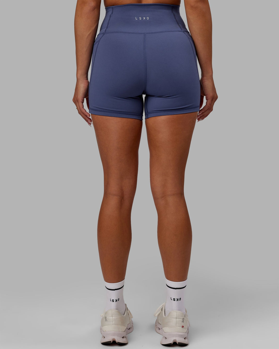 Woman wearing Fusion Ultra High-Rise 4" Short Pockets - Future Dusk | Model:Gabby | Size:S