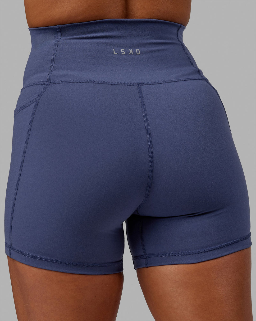 Woman wearing Fusion Ultra High-Rise 4" Short Pockets - Future Dusk | Model:Gabby | Size:S